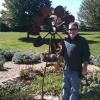 John Raymond and his donated art sculpture